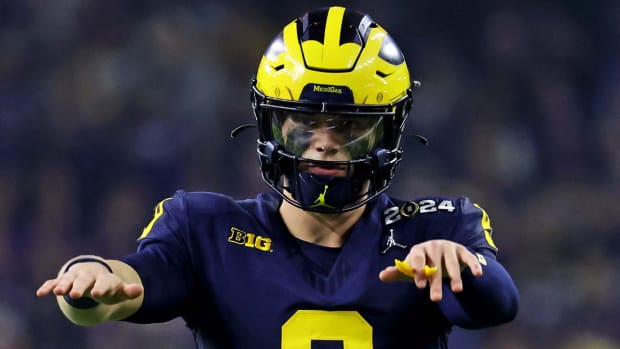 Michigan quarterback J.J. McCarthy signals to the team during the national championship game.